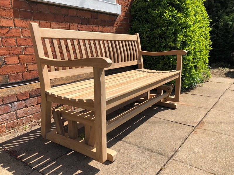 Product photograph of Teak Glider Bench 1 5m Pre-order from The Garden Furniture Centre Ltd