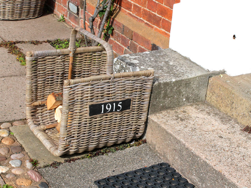 Product photograph of Kubu Half Round Log Basket from The Garden Furniture Centre Ltd