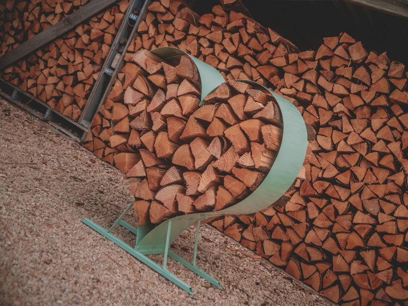Product photograph of Sage Green Love Heart Wood Rack from The Garden Furniture Centre Ltd