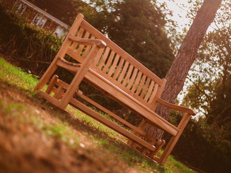 Product photograph of Teak Glider Bench 1 3m from The Garden Furniture Centre Ltd