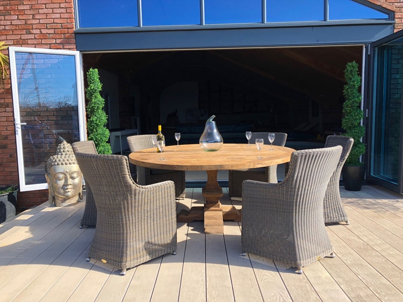 Product photograph of Seville 6 Chair Round Teak Dining Set from The Garden Furniture Centre Ltd